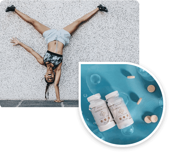 Sportive en équilibre sur les mains à côté de flacons Immunity+